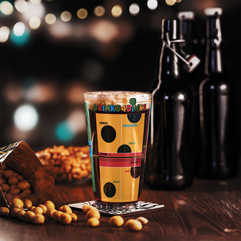 Drinks4Dinks pint glass printed with a pickleball drinking game design