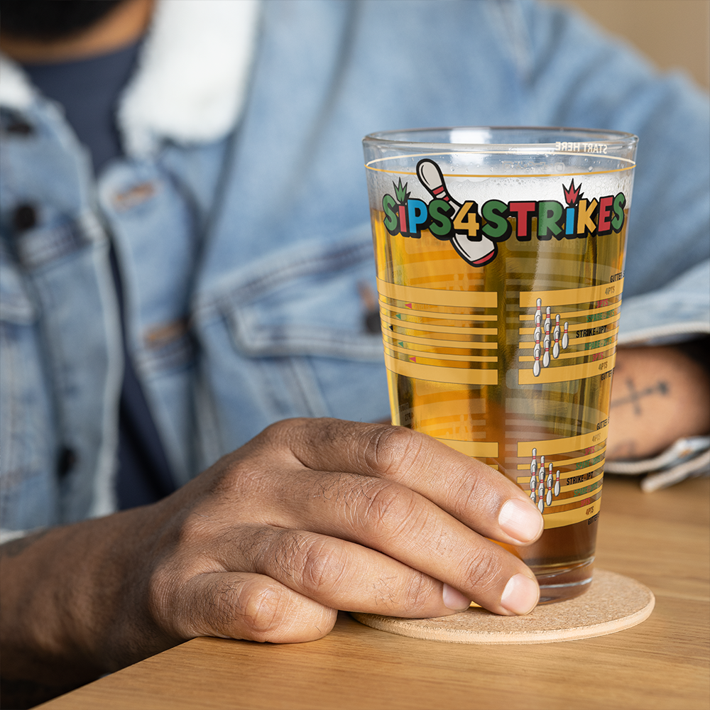 Sips4Strikes pint glass printed with four stacked bowling frames for a bowling drinking game