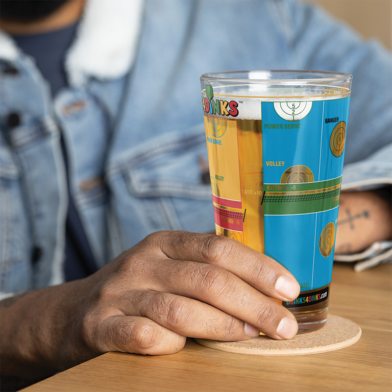 Drinks4Dinks pint glass printed with a pickleball drinking game design